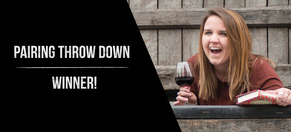 Rachel is shown on the right laughing and holding a book and glass of wine. On the left, a black background with the following white text "Pairing Throw Down Winner!"