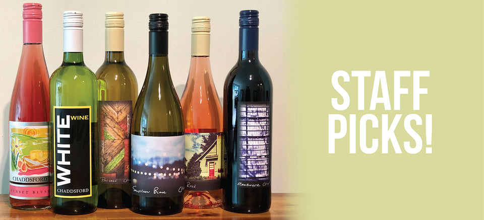 Staff Pick wines are lined up on the left. On the right, cream background with the following white text" Staff Picks!"
