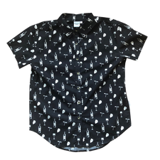 Front of women's black button up shirt. Design pattern features repeated glasses of wine, cheese blocks, bottles of wine and wine openers in white. 